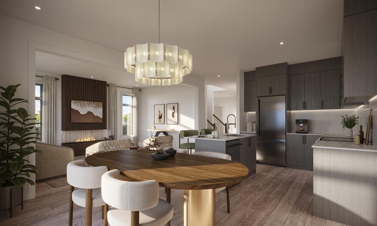 Open-concept kitchen and dining room with a linear fireplace, oak floors and a large island in a North Hill home